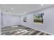 Bright living room featuring hardwood floors and fresh paint at 12302 Tangier St, North Port, FL 34287