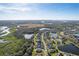 Aerial view of a community with lakes and houses at 12721 20Th E St, Parrish, FL 34219