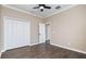 Bright bedroom with double-door closet and ceiling fan at 12721 20Th E St, Parrish, FL 34219