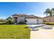 Single-Gathering home with two-car garage and manicured lawn at 12721 20Th E St, Parrish, FL 34219