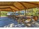 Wooden picnic pavilion with multiple tables, perfect for outdoor gatherings at 12721 20Th E St, Parrish, FL 34219