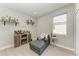 Cozy bonus room featuring a daybed, beverage center and a window at 13951 Wood Duck Cir, Lakewood Ranch, FL 34202