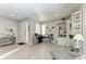 Bright and airy living room with a cozy reading nook and built-in bookshelves at 13951 Wood Duck Cir, Lakewood Ranch, FL 34202