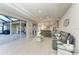 Bright living room with sliding glass doors, tile floors, and comfortable seating at 13951 Wood Duck Cir, Lakewood Ranch, FL 34202