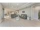 Open-concept living room featuring recessed lighting, tile flooring, and comfortable gray sofas at 13951 Wood Duck Cir, Lakewood Ranch, FL 34202
