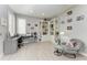 Comfortable office space with a large desk, bookshelves, and cozy chair at 13951 Wood Duck Cir, Lakewood Ranch, FL 34202