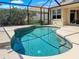 Sparkling screened-in pool, offering a refreshing escape and views of the beautiful landscape, perfect for outdoor enjoyment at 13951 Wood Duck Cir, Lakewood Ranch, FL 34202
