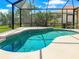 Captivating screened-in pool with crystal-clear water, designed for relaxation and offering views of the lush surroundings at 13951 Wood Duck Cir, Lakewood Ranch, FL 34202