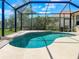 Screened-in pool with cool, clear water, designed for relaxation and enjoying beautiful views of the surrounding landscape at 13951 Wood Duck Cir, Lakewood Ranch, FL 34202