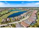 Panoramic aerial view of a planned community with a golf course and water features at 15603 Derna Ter, Bradenton, FL 34211
