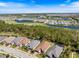 Aerial view of a golf course community with lush landscaping and ponds at 15603 Derna Ter, Bradenton, FL 34211