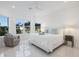 Bright bedroom featuring neutral walls, many windows, and a ceiling fan at 15603 Derna Ter, Bradenton, FL 34211