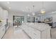 Bright, open kitchen overlooking the living area and an outdoor pool through sliding glass doors at 15603 Derna Ter, Bradenton, FL 34211