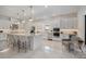 Well-lit kitchen with stainless steel appliances, sleek white cabinets, and large island at 15603 Derna Ter, Bradenton, FL 34211