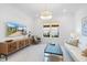 Bright living room with a large window, modern lighting, and white marble floors at 15603 Derna Ter, Bradenton, FL 34211