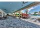 Covered patio area with outdoor seating and views of the pool at 15603 Derna Ter, Bradenton, FL 34211