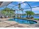 Relaxing kidney-shaped pool with lake view at 17404 Hickok Belt Loop, Bradenton, FL 34211