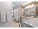 Bathroom with granite countertop, rustic wood accents and shower at 324 Bernard Ave, Sarasota, FL 34243