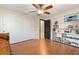 Bedroom with hardwood floors, sliding doors, and built in shelving at 324 Bernard Ave, Sarasota, FL 34243