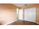 Simple bedroom with wood flooring and a large closet at 4107 11Th E St, Bradenton, FL 34208