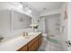 Clean bathroom with tub, shower, and wood vanity at 4132 Carriage Cir # 12, Sarasota, FL 34241