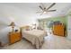 Spacious bedroom with a queen-size bed, dresser, and sliding door to patio at 4132 Carriage Cir # 12, Sarasota, FL 34241