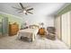 Spacious bedroom with ceiling fan and tile floors at 4132 Carriage Cir # 12, Sarasota, FL 34241