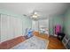 Spacious bedroom with wood floors, built-in shelving and access to upper level at 4132 Carriage Cir # 12, Sarasota, FL 34241
