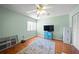 Bright bedroom with wood floors, ceiling fan, and ample natural light at 4132 Carriage Cir # 12, Sarasota, FL 34241