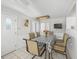 Casual dining area with table and chairs near kitchen and exterior access at 4132 Carriage Cir # 12, Sarasota, FL 34241