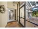 Front entry with a glass door and a screened porch at 4132 Carriage Cir # 12, Sarasota, FL 34241