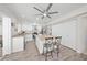Modern kitchen featuring stainless steel appliances, an island, and white shaker cabinets at 4132 Carriage Cir # 12, Sarasota, FL 34241