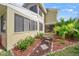 Private patio with landscaping and access from ground floor at 4132 Carriage Cir # 12, Sarasota, FL 34241