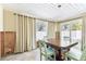 View of dining area with sliding glass doors to patio at 426 62Nd St, Holmes Beach, FL 34217