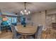 Bright dining area with round table and seating for four, overlooking the living room at 4307 Gulf Dr # 103, Holmes Beach, FL 34217