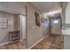 Inviting entryway with wood-look floors and beach-themed decor at 4307 Gulf Dr # 103, Holmes Beach, FL 34217