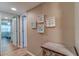 Hallway with light taupe walls, wood floors, and framed artwork at 4307 Gulf Dr # 103, Holmes Beach, FL 34217