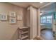 Hallway with a sand dollar decoration leading to a bedroom with a ceiling fan at 4307 Gulf Dr # 103, Holmes Beach, FL 34217