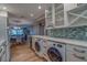 Open concept kitchen with island, wine cooler, and eat in kitchen that flows to the living area at 4307 Gulf Dr # 103, Holmes Beach, FL 34217