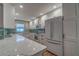 Modern kitchen with white cabinets, quartz countertops, and stainless steel appliances at 4307 Gulf Dr # 103, Holmes Beach, FL 34217