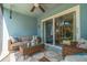 Relaxing lanai with comfortable seating and views of the exterior at 4307 Gulf Dr # 103, Holmes Beach, FL 34217