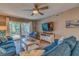 Spacious living room with comfortable seating and access to a patio at 4307 Gulf Dr # 103, Holmes Beach, FL 34217