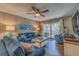 Bright living room with comfortable sofas, a large window, and access to a patio at 4307 Gulf Dr # 103, Holmes Beach, FL 34217