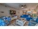Spacious living room with hardwood floors and cozy seating, ideal for relaxation at 4307 Gulf Dr # 103, Holmes Beach, FL 34217