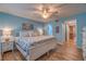 Main bedroom with king-size bed and light blue walls at 4307 Gulf Dr # 103, Holmes Beach, FL 34217
