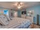 Tranquil bedroom with light blue walls, ceiling fan, and ample closet space at 4307 Gulf Dr # 103, Holmes Beach, FL 34217