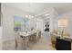 Dining area with light-toned furniture and entryway view at 4989 Ageman Ave, North Port, FL 34288