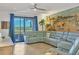 Spacious living room with sectional sofa and beach-themed wall art at 5558 Palmer Cir # 101, Bradenton, FL 34211