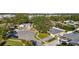 Aerial view of a quiet residential neighborhood with lush green trees at 719 Wood Ln, Sarasota, FL 34237