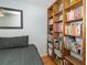 Extensive built-in wooden bookshelves filled with books and records at 719 Wood Ln, Sarasota, FL 34237